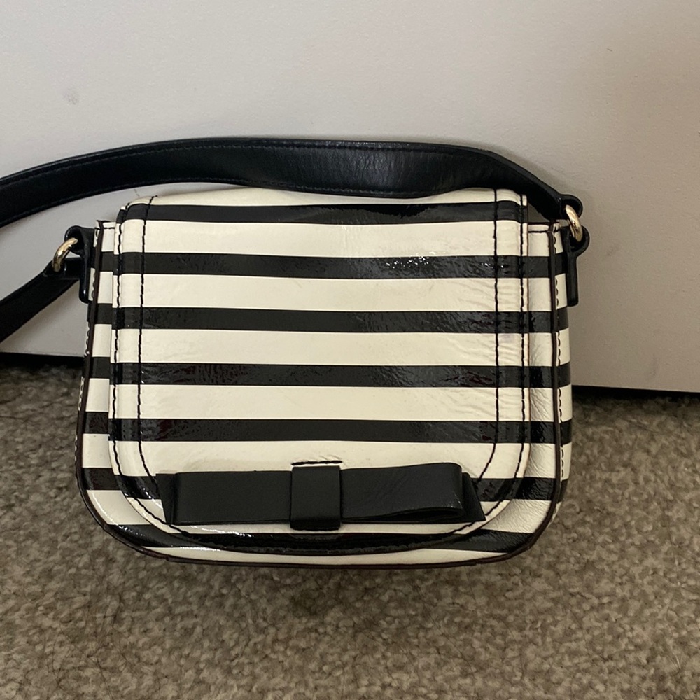 Black and white patent leather purse.